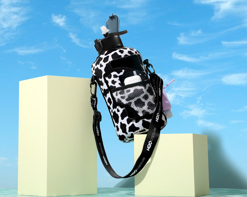 Cowbell - Carry-all- Half Gallon Water Bottle with Storage Sleeve and Covered Straw Lid