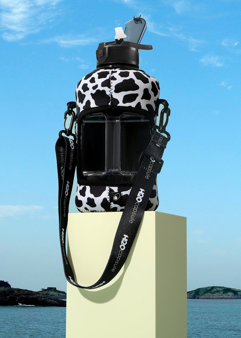Cowbell - Carry-all- Half Gallon Water Bottle with Storage Sleeve and Covered Straw Lid